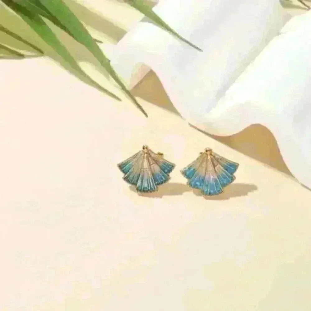 Delicate Fan-Shaped Pendant Accented with Shimmering Blue Hues